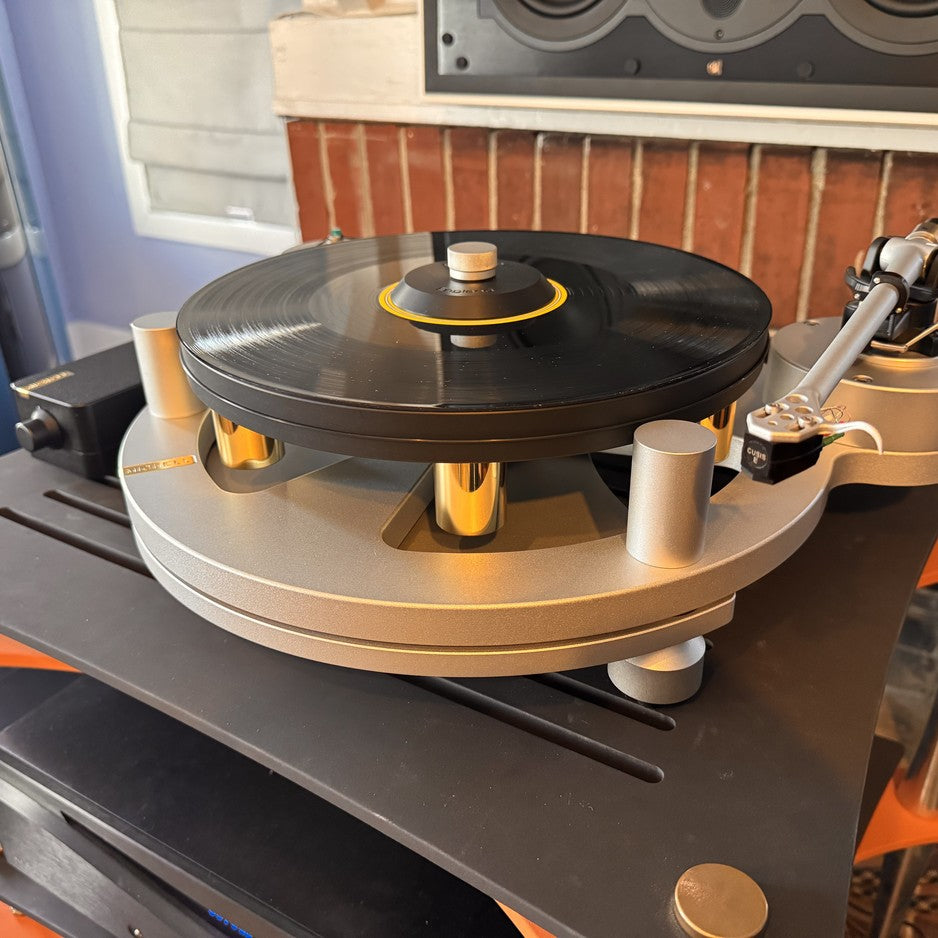 Michell Gyro turntable three-quarter view showing tonearm, cartridge, and suspension towers