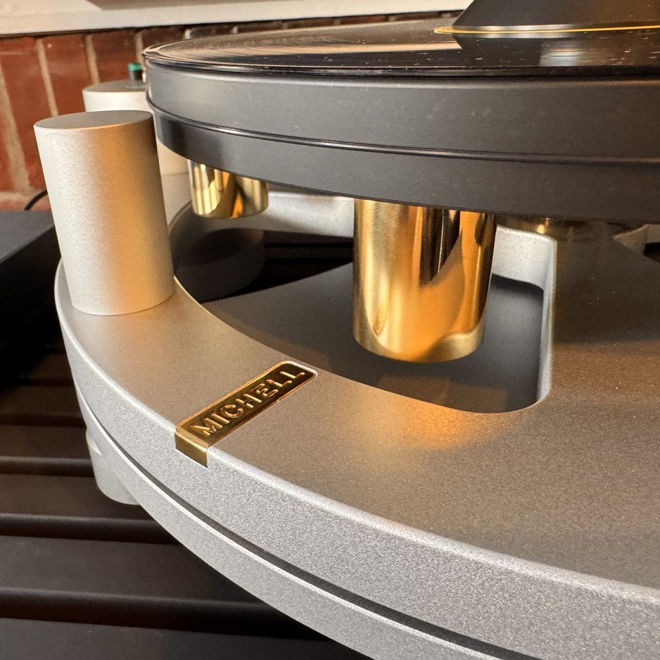Michell Gyro turntable close-up of suspension towers, badge, and subchassis construction