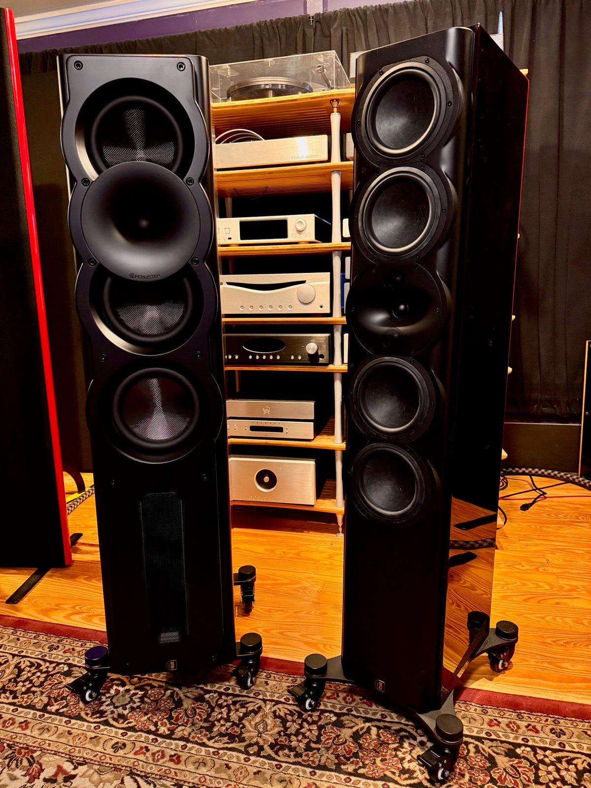 Perlisten A4t and R7t towers side by side showing the range from A-Series to R-Series