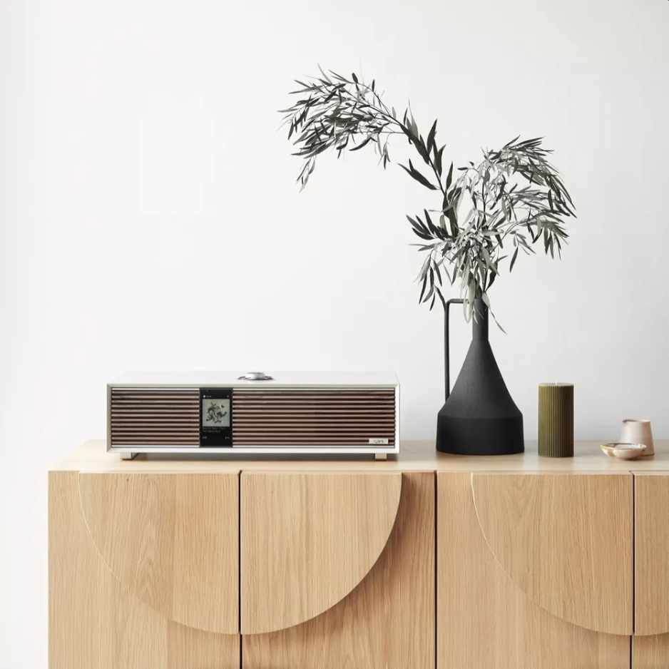 Ruark Audio R410 Integrated Music System Lifestyle photo R410 on media console next to black vase looking elegant