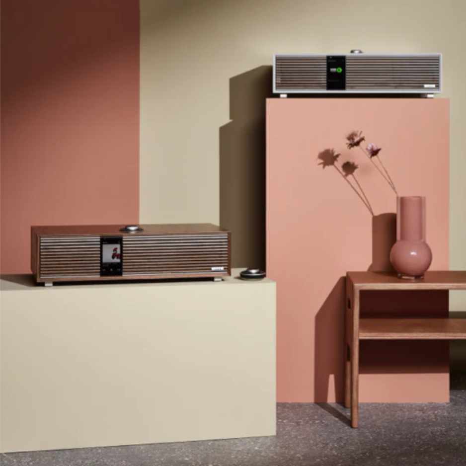Ruark Audio R410 Integrated Music System Lifestyle photo with pink vase and both colors of R410 on shelves