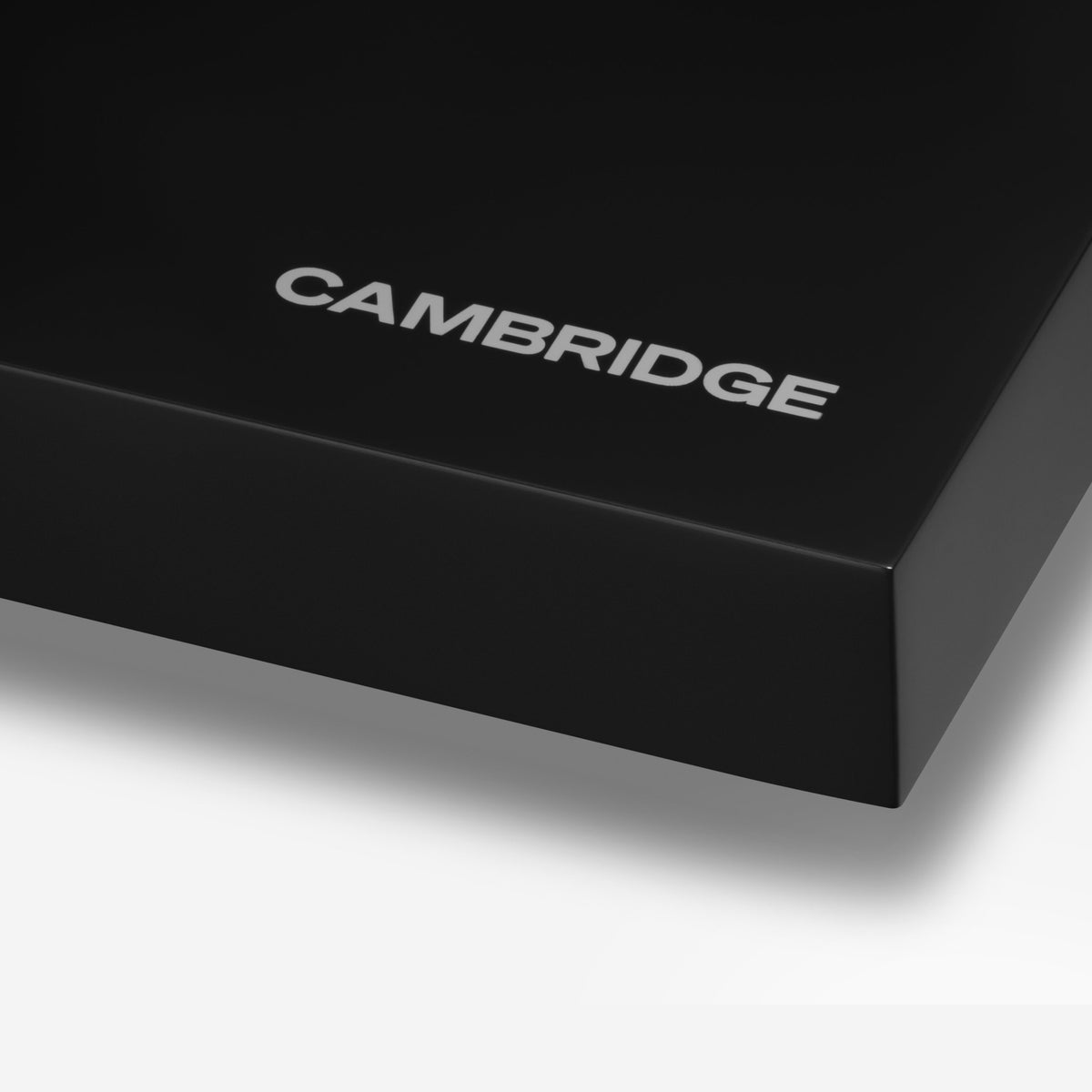Cambridge Audio Spira Belt Drive Turntable, Black, plinth corner and Cambridge logo close-up