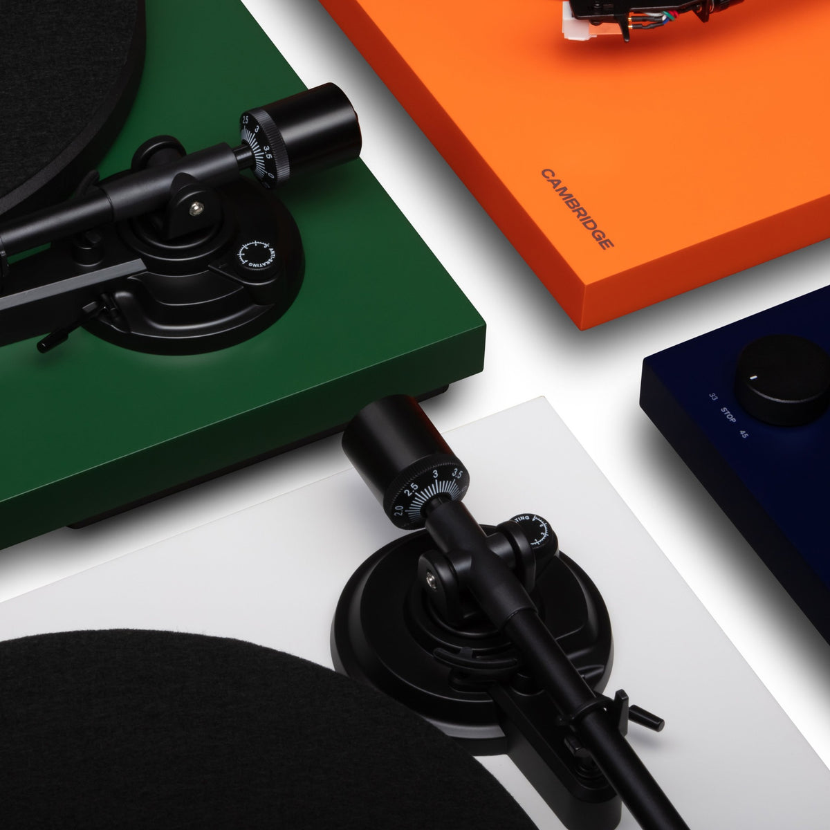 Cambridge Audio Spira Belt Drive Turntables, Green, Orange, White and Blue, overhead group shot of four finishes