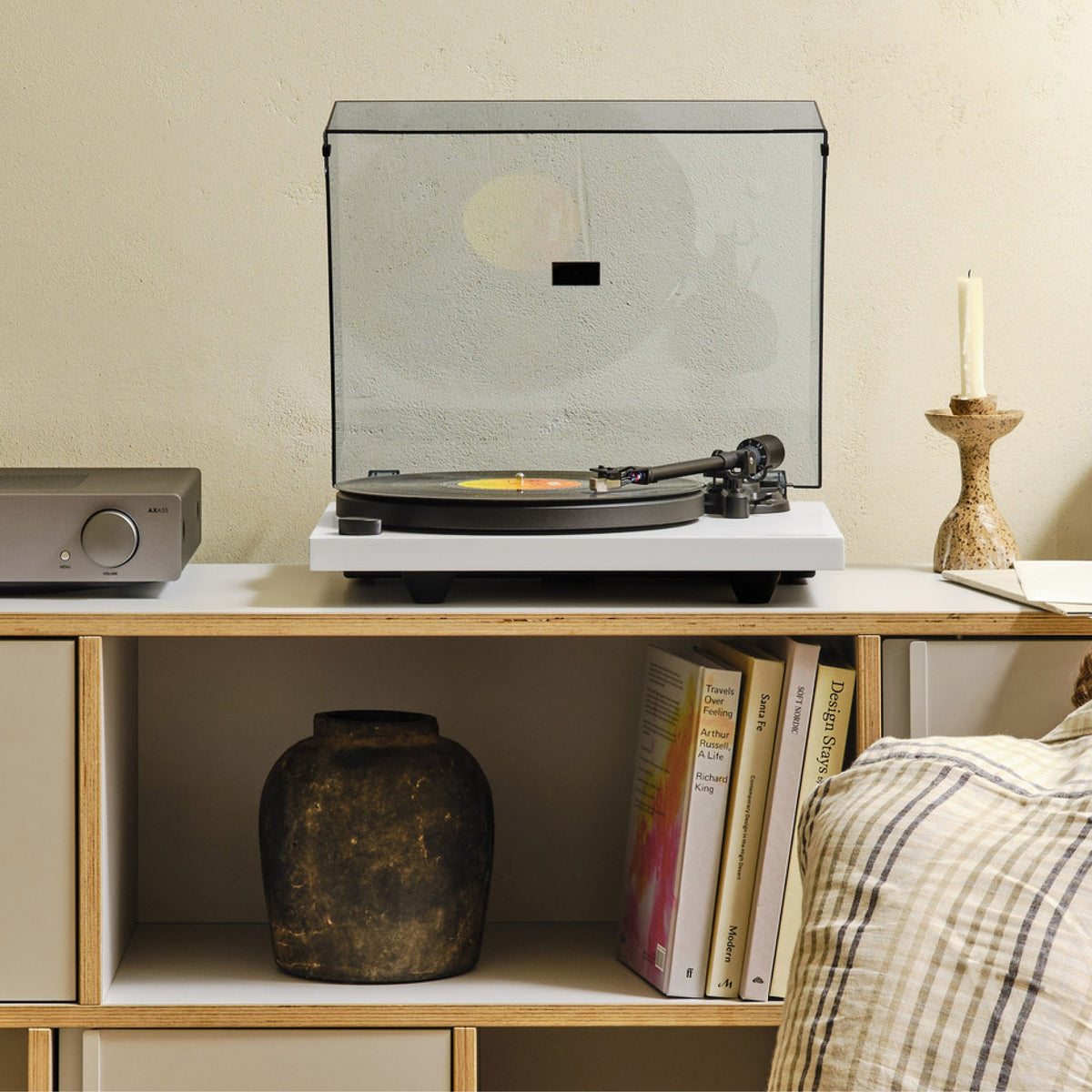 Cambridge Audio Spira Belt Drive Turntable, White, lifestyle, on a sideboard with the dust cover closed