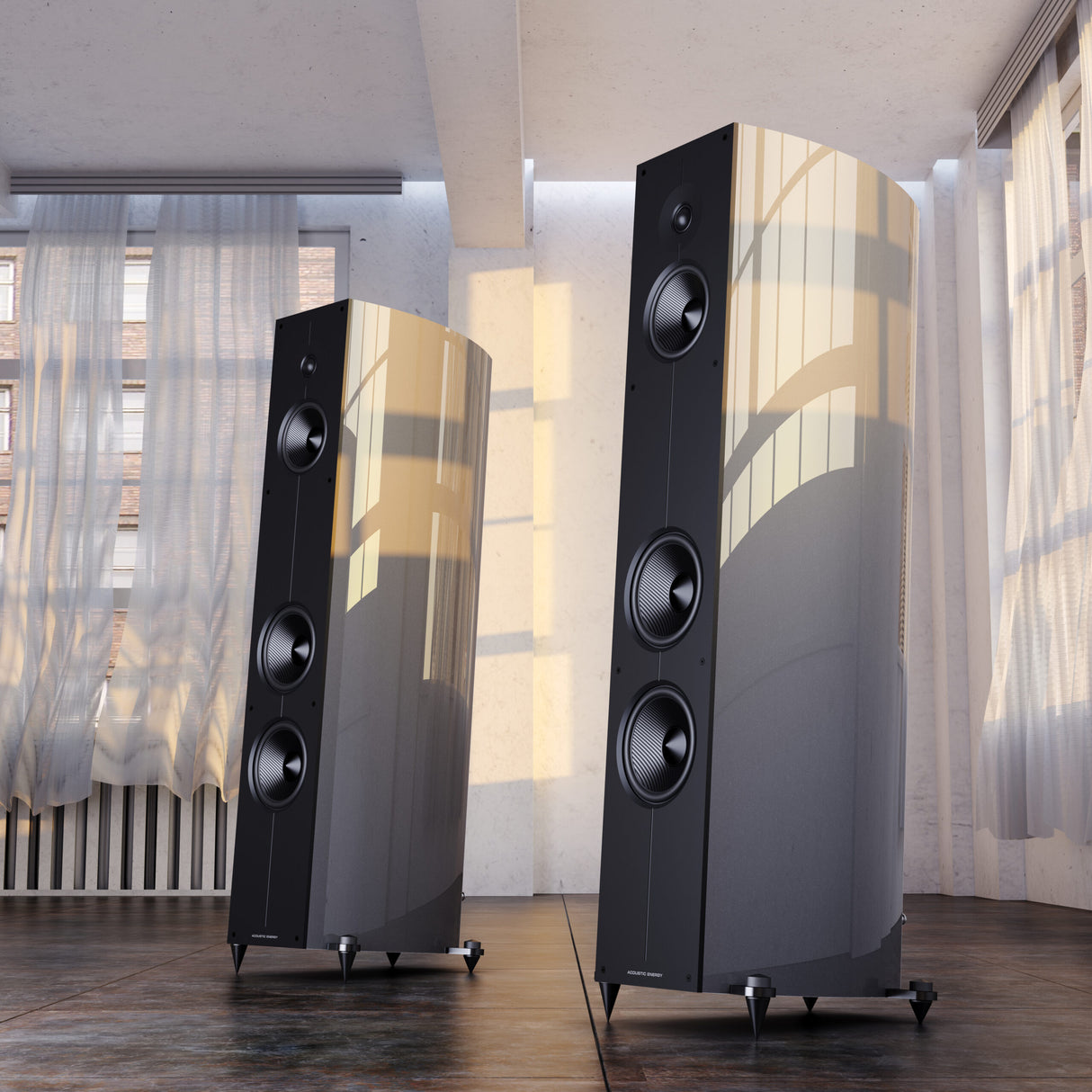 Acoustic Energy Corinium floorstanding speakers in Midnight Silver finish, pair shown in living room setting