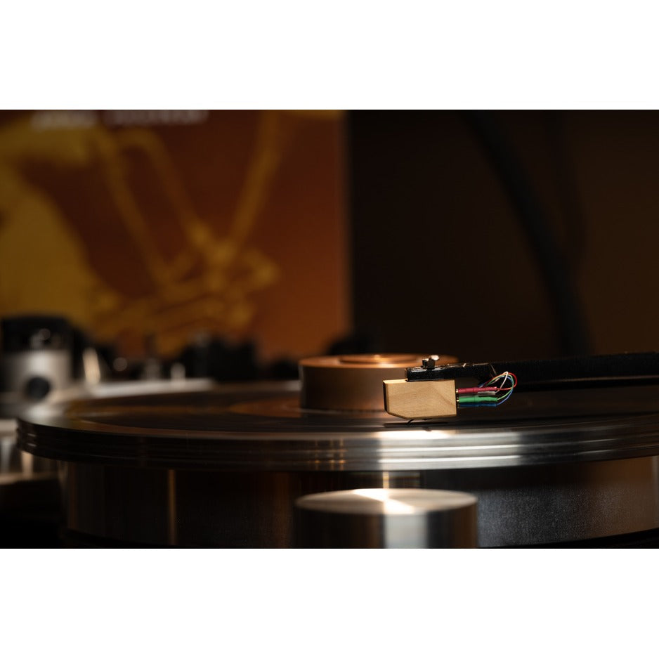 Grado Sonata4 cartridge side profile playing vinyl, jazz album visible in background