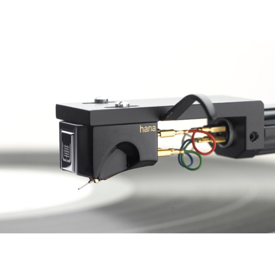 HANA Umami Black Moving Coil Cartridge (Open Box), mounted on a headshell above a record with the tonearm attached