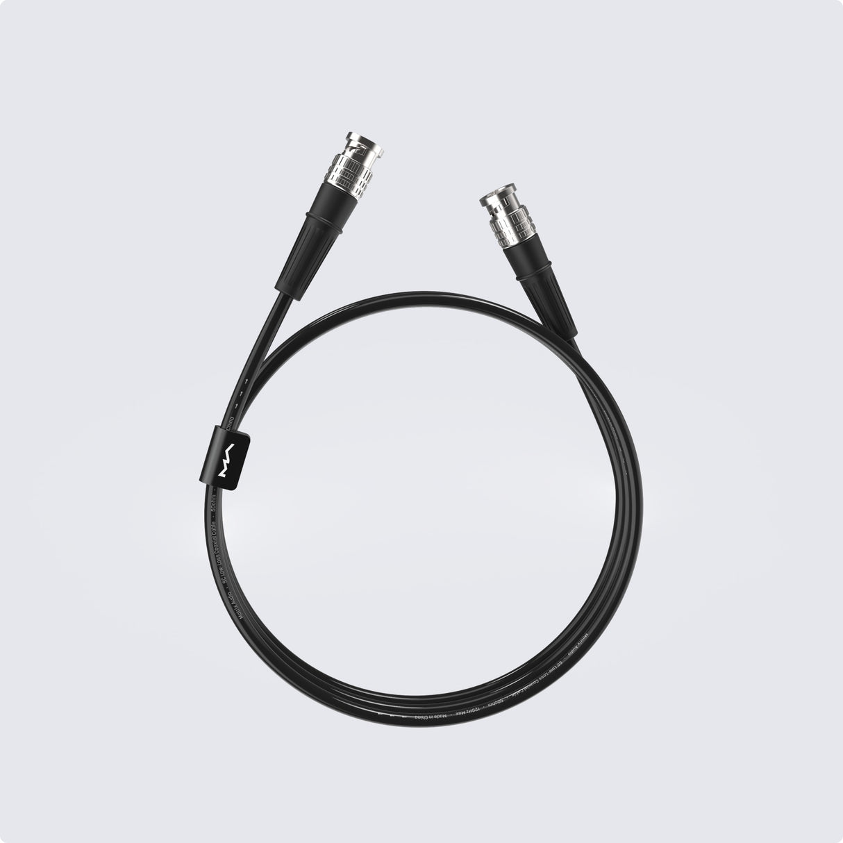 Matrix Audio Silver Copper Hi-Fi Clock Cable, Black, coiled three-quarter view on gray gradient