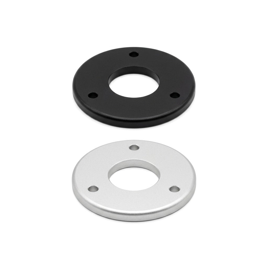 Michell Rega Arm Spacer Turntable Accessory, Black and Silver, three-quarter view of both finishes together