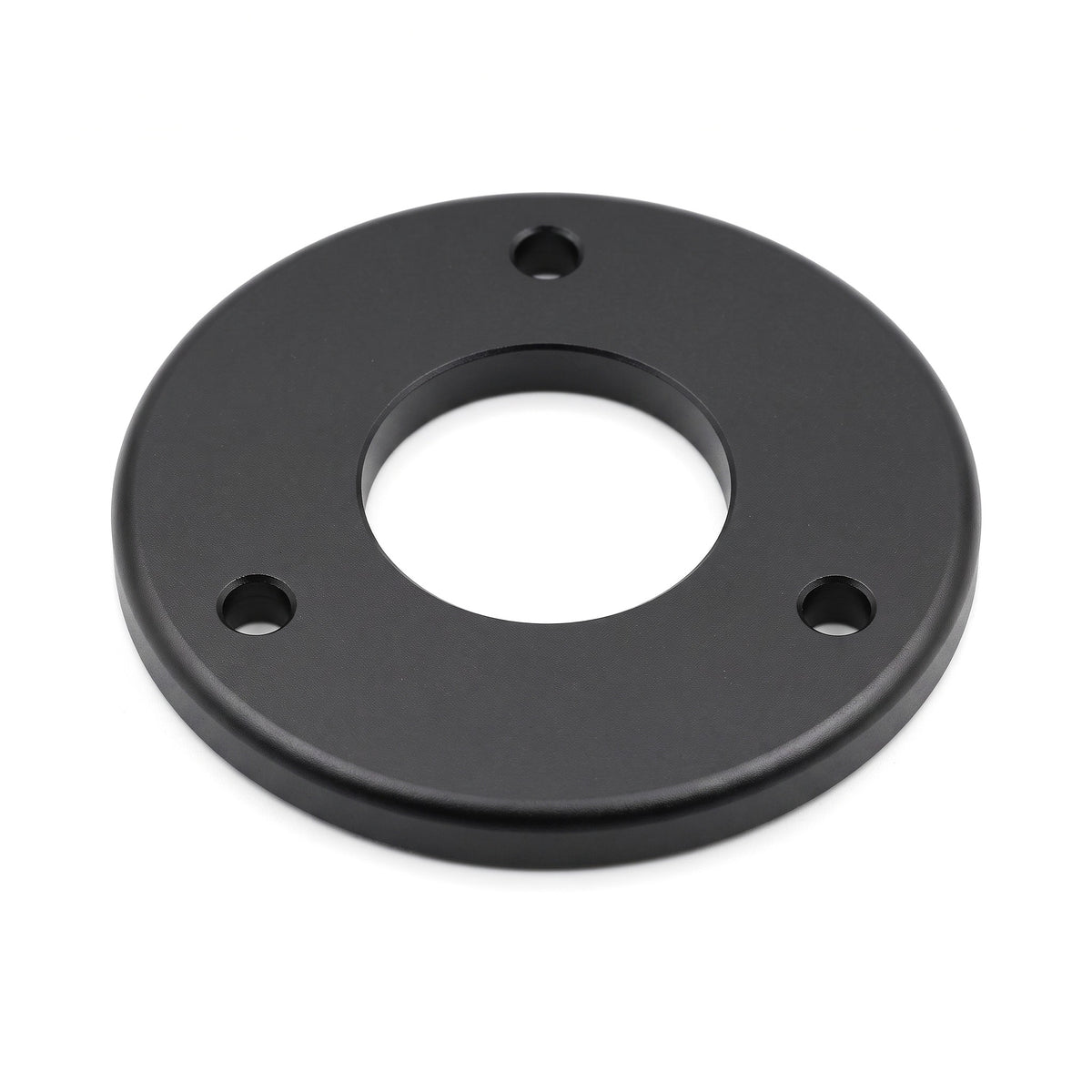 Michell Rega Arm Spacer Turntable Accessory, Black, three-quarter view showing the 3-bolt hole pattern