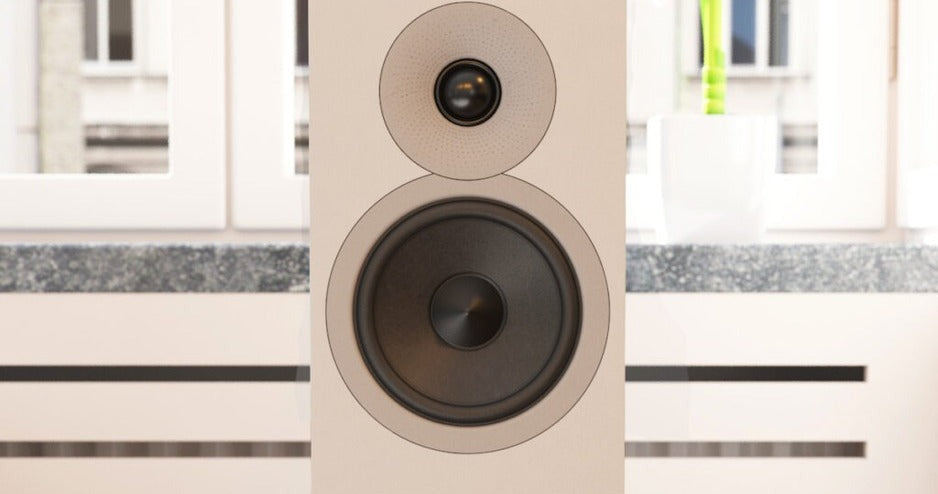 Acoustic Energy AE300² bookshelf speaker in silk-touch matte white on a stand, grille removed