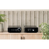 Cyrus 40 PPA phono preamplifier alongside turntable on wooden credenza in living room