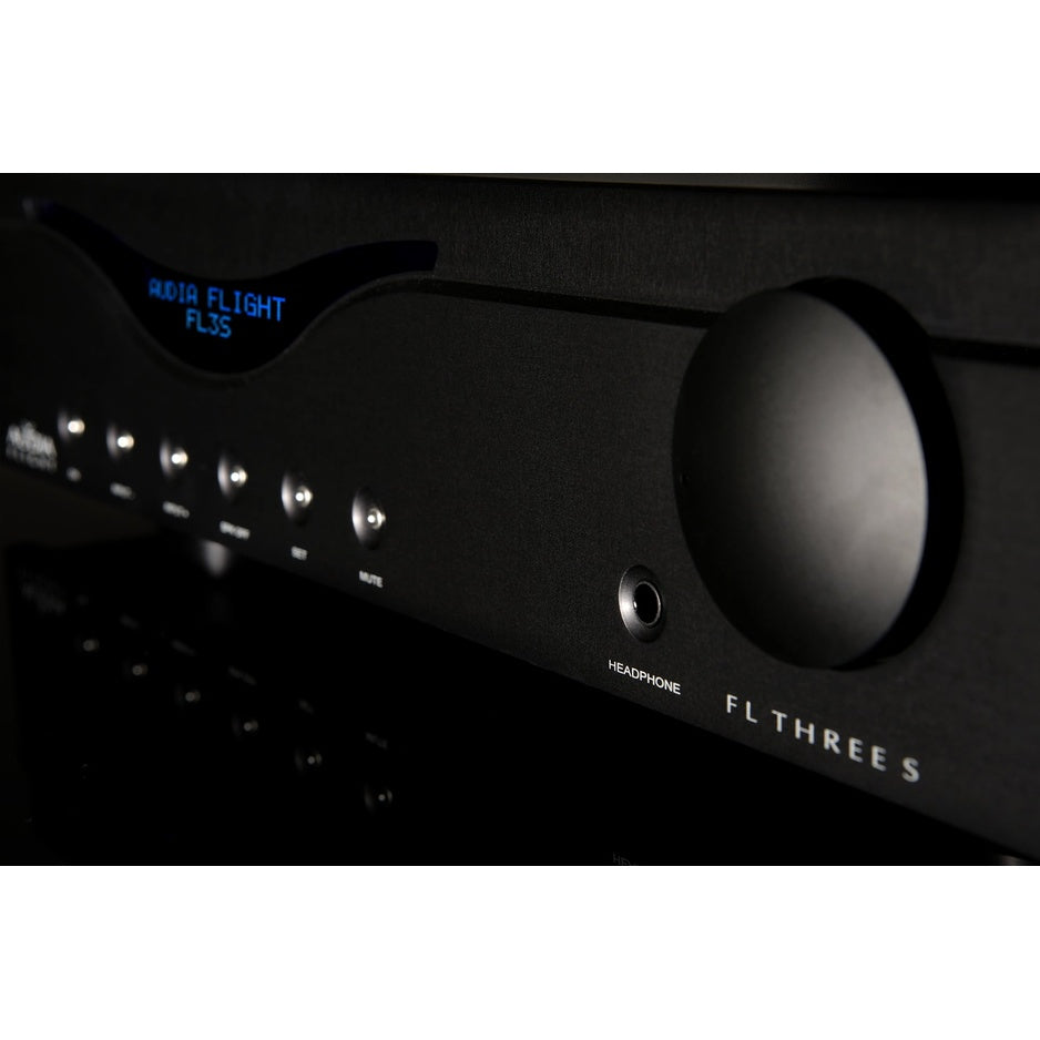 Audia Flight Three S volume knob and headphone output on black finish