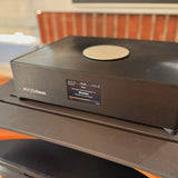 Grimm Audio MU2 displaying Roon interface with album art on the built-in screen