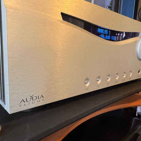 Audia Flight FLS 10 front panel showing all controls, display, and volume knob