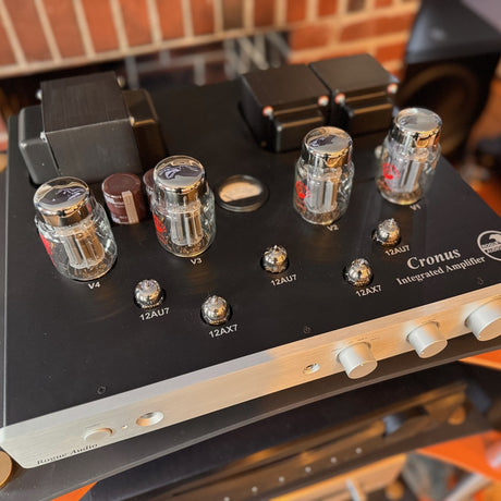 Rogue Audio Cronus Magnum III Dark Edition three-quarter view with tubes glowing at The Listening Room