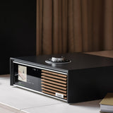 Ruark Audio R610 Music Console in Soft Charcoal, lifestyle on console with curtain backdrop