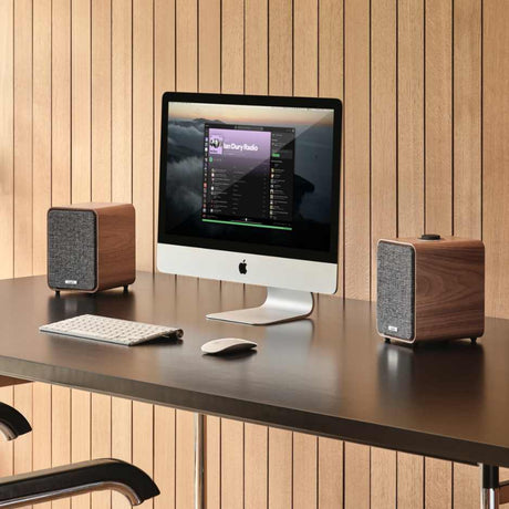 Ruark Audio MR1 MK3 Desktop Speaker System Walnut flanking Mac Computer with Keyboard and Mouse