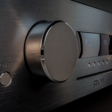 AVM Ovation CS 8.3 S Streaming CD Receiver, Black, front fascia close-up with the source knob and display