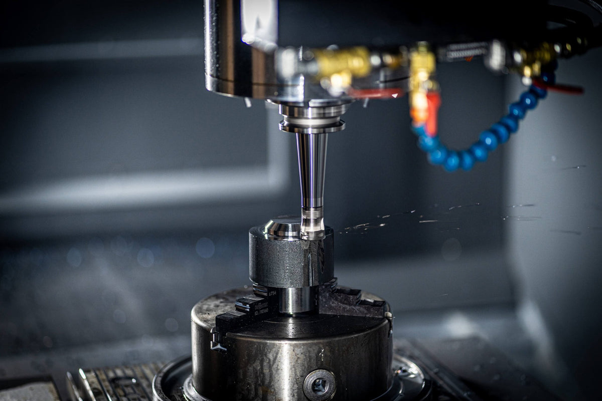 CNC milling machine cutting precision aluminium components at Wilson Benesch Falcon House manufacturing facility in Sheffield