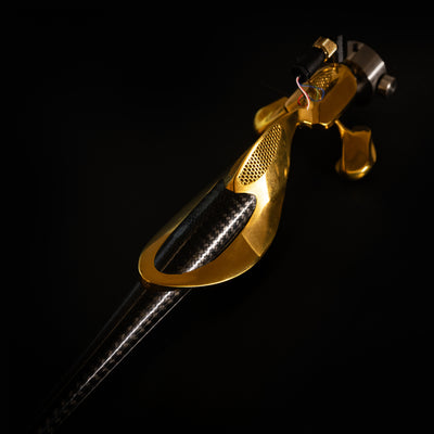 Wilson Benesch Graviton Ti tonearm in polished gold showing the quadruple-helix carbon fiber armtube, tessellated titanium counterbalance, and integrated headshell