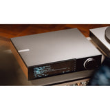Cambridge Audio Evo 300 streaming amplifier on a media console