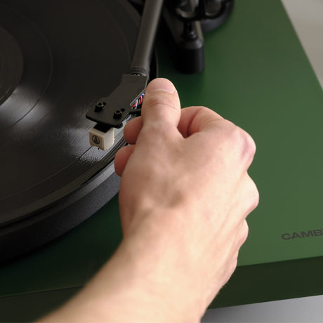 Cambridge Audio Spira Belt Drive Turntable, Green, lifestyle, cueing the tonearm by hand