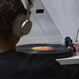 Cambridge Audio Spira Belt Drive Turntable, lifestyle, listening on headphones while cueing a record