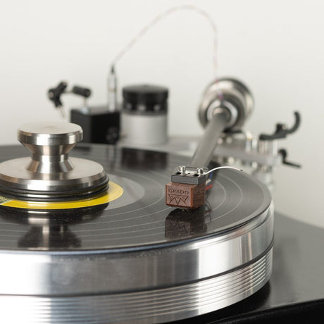 Grado Lineage cartridge with GRADO branding visible on wood body