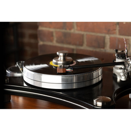 Grado Aeon4 cartridge on turntable, brick wall and warm lighting