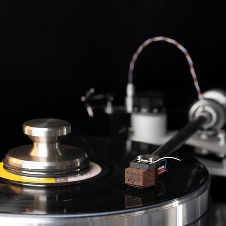 Grado Lineage cartridge dramatic black background with tonearm