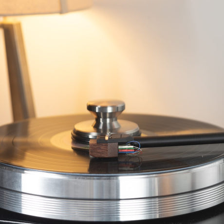 Grado Lineage cartridge on turntable with warm lamp lighting