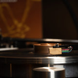 Grado Platinum4 on turntable with album art background