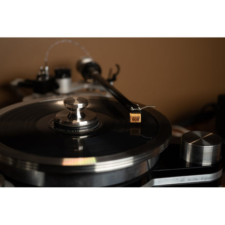Grado Platinum4 cartridge tracking vinyl, Mediterranean Olive wood body visible on tonearm