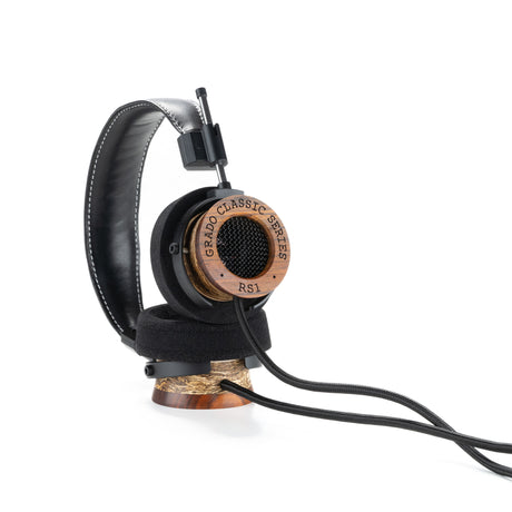 Grado RS1 Classic Series Open-Back Headphones, Tri-Wood, angled view resting on a wooden headphone stand