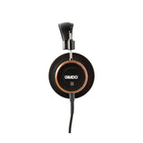 Grado Signature S550 Open-Back Headphones, Brazilian Walnut, side profile of a single earcup with the Grado badge and Brazilian Walnut housing facing camera