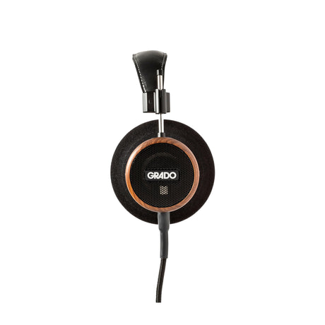 Grado Signature S550 Open-Back Headphones, Brazilian Walnut, side profile of a single earcup with the Grado badge and Brazilian Walnut housing facing camera