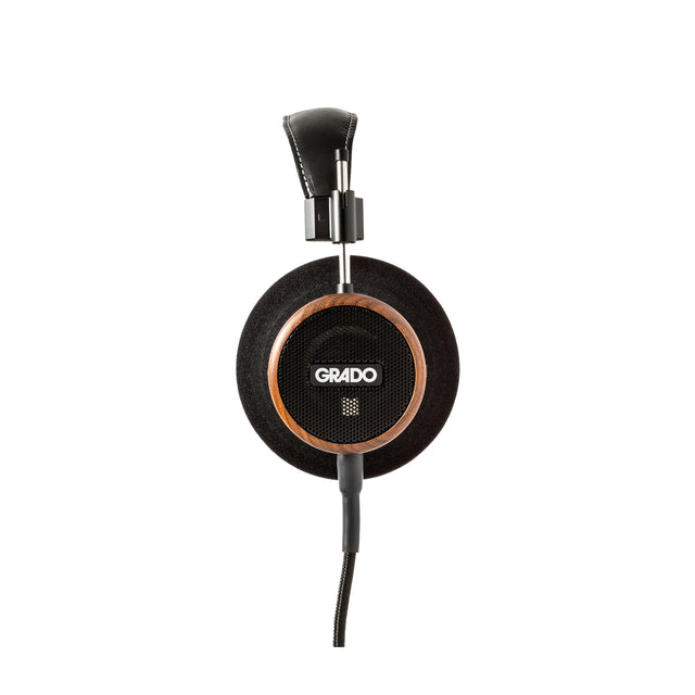 Grado Signature S550 Open-Back Headphones, Brazilian Walnut, side profile of a single earcup with the Grado badge and Brazilian Walnut housing facing camera