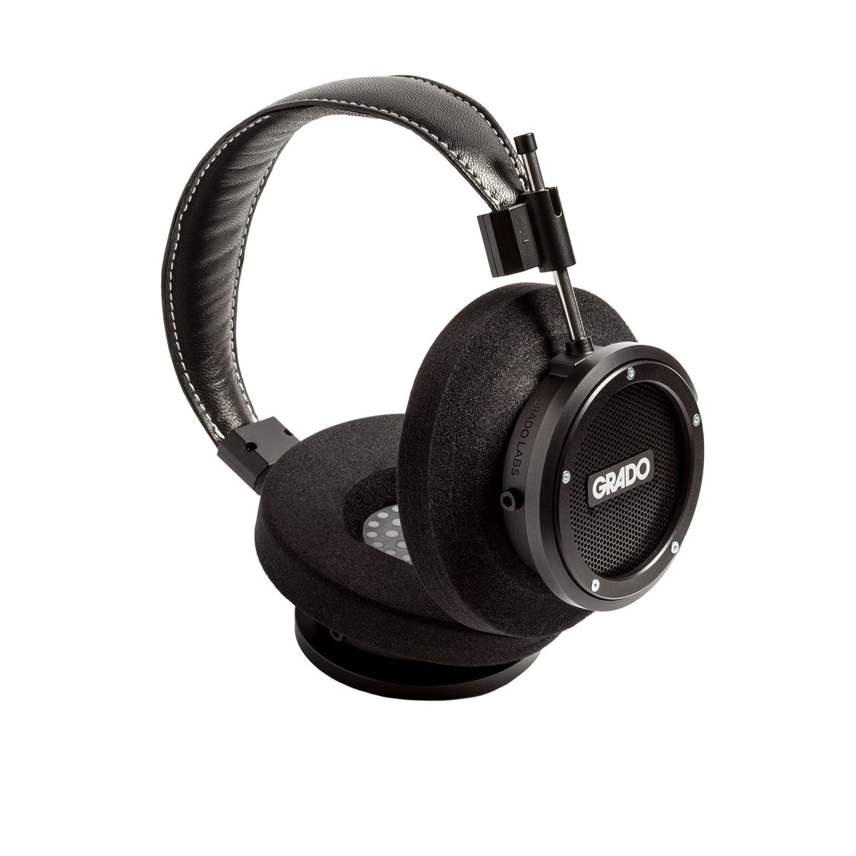 Grado Signature S750 Open-Back Headphones, Black Aluminum, angled view resting on a headphone stand