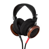 Grado Signature S950 Open-Back Headphones, Brazilian Walnut, three-quarter view from the cushion side with the detachable cable attached