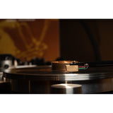 Grado Sonata4 cartridge side profile playing vinyl, jazz album visible in background