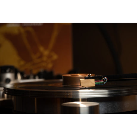 Grado Sonata4 cartridge side profile playing vinyl, jazz album visible in background