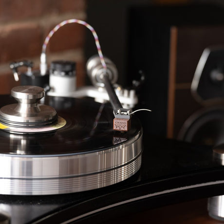 Grado Lineage cartridge in system with brick wall backdrop