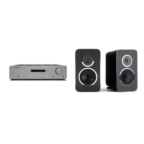 Mike's $1,299 HiFi System: Cambridge Audio AXR100 stereo receiver in grey beside a pair of Rega Kyte bookshelf speakers in black, one facing forward and one angled to show its curved cabinet