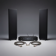 Magnepan 1.7x planar magnetic speakers flanking a Primare I15 Prisma MK2 amplifier with ViaBlue SC-4 speaker cables in a dark studio setting