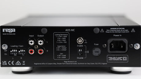 Rega AOS MC rear panel showing RCA connections, dip switches for loading, capacitance and gain adjustment