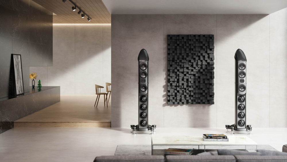 Wilson Benesch Eminence setup in a luxury home - viewing them from a couch in front of a concrete wall with a diffuser panel