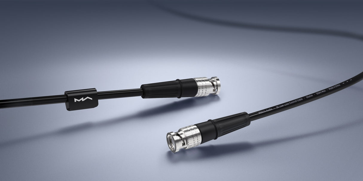 Matrix Audio Silver Copper Hi-Fi Clock Cable, Black, two BNC connectors lifestyle, on a dark surface