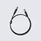 Matrix Audio Silver Copper Hi-Fi Clock Cable, Black, coiled three-quarter view on gray gradient