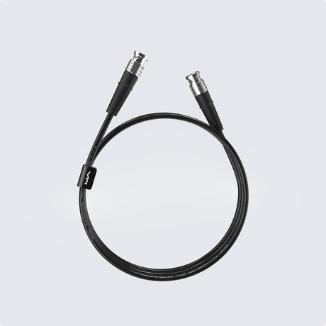 Matrix Audio Silver Copper Hi-Fi Clock Cable, Black, coiled three-quarter view on gray gradient